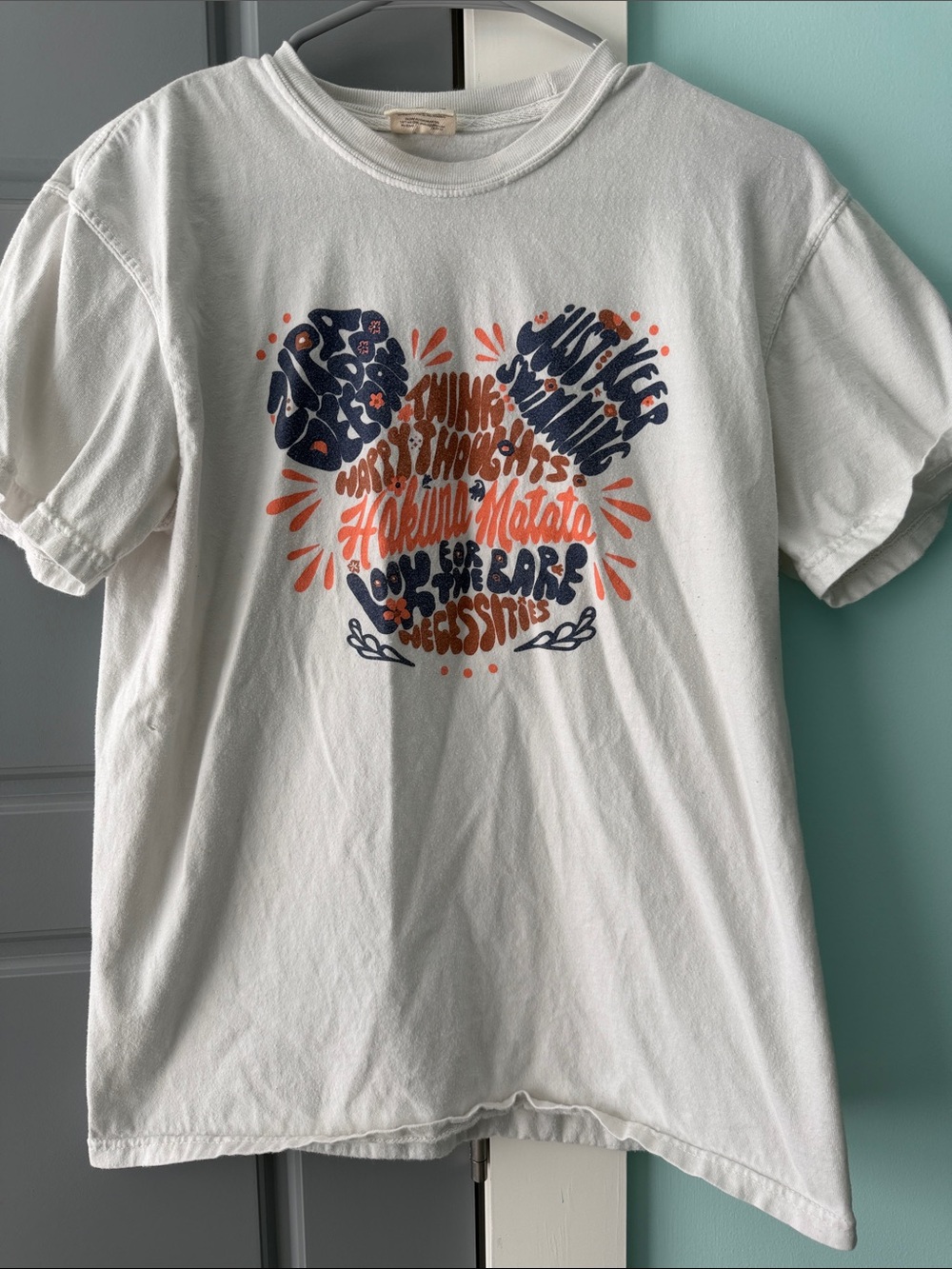 White Short-Sleeve Graphic Tee with Orange & Navy Design